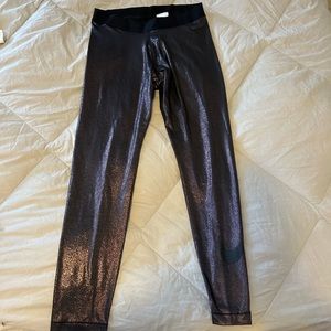 Size XL Nike shimmer leggings. Nike logo on leg. Never worn.